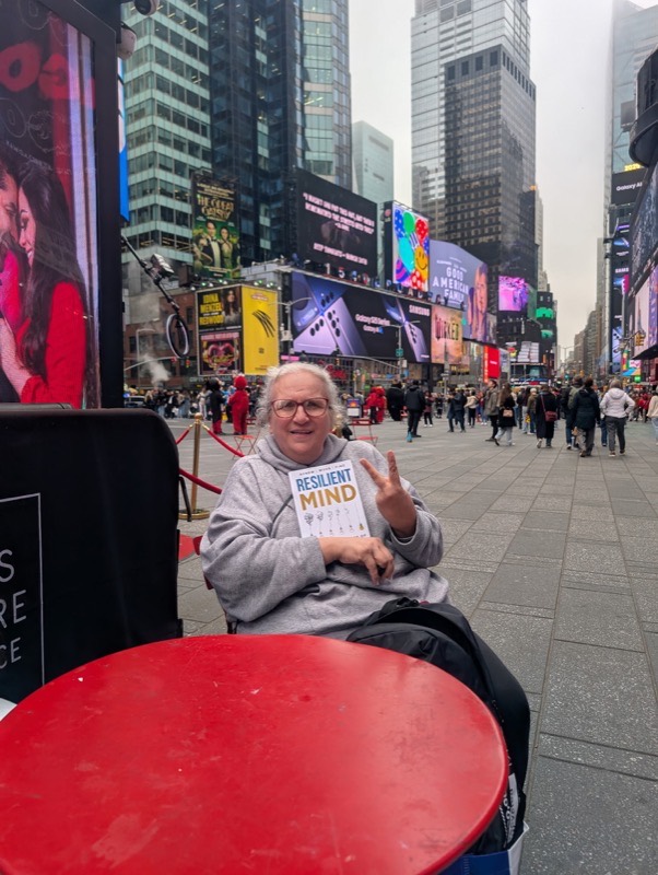 Reader 3 with their copy of RESILIENT MIND